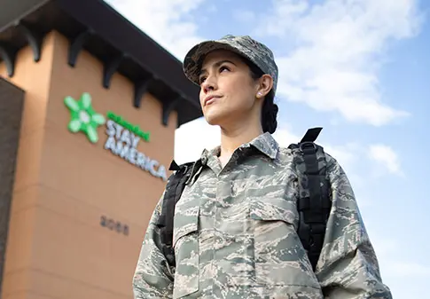 Military personnel outside of an Extended Stay America hotel